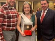 Shumway: Vancouver School of Arts and Academics senior Kate Bias, center, accepts her title of American Rabbit Breeders Association Queen with Eric Stewart, executive director of the association, left, and Josh Humphries, president of the association.