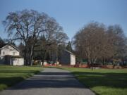 A new multi-use walking path leads the way to the East Barracks at Fort Vancouver National Site on Nov. 21. The path, until recently Alvord Road, used to be open to cars but was recently restricted to pedestrians and cyclists.