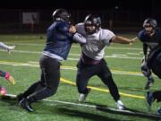 Hockinson senior Takumi Veley, center, runs through drills with his teammates during practice at District Stadium in Battle Ground Thursday, Nov. 21, 2019. Hockinson will face Lakewood on Saturday in the Class 2A state quarterfinal.