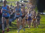 Warner Pacific’s Amelia Pullen, right, competes in the women’s 5 kilometer race during the NAIA Cross Country National Championships on Friday morning, Nov. 22, 2019.