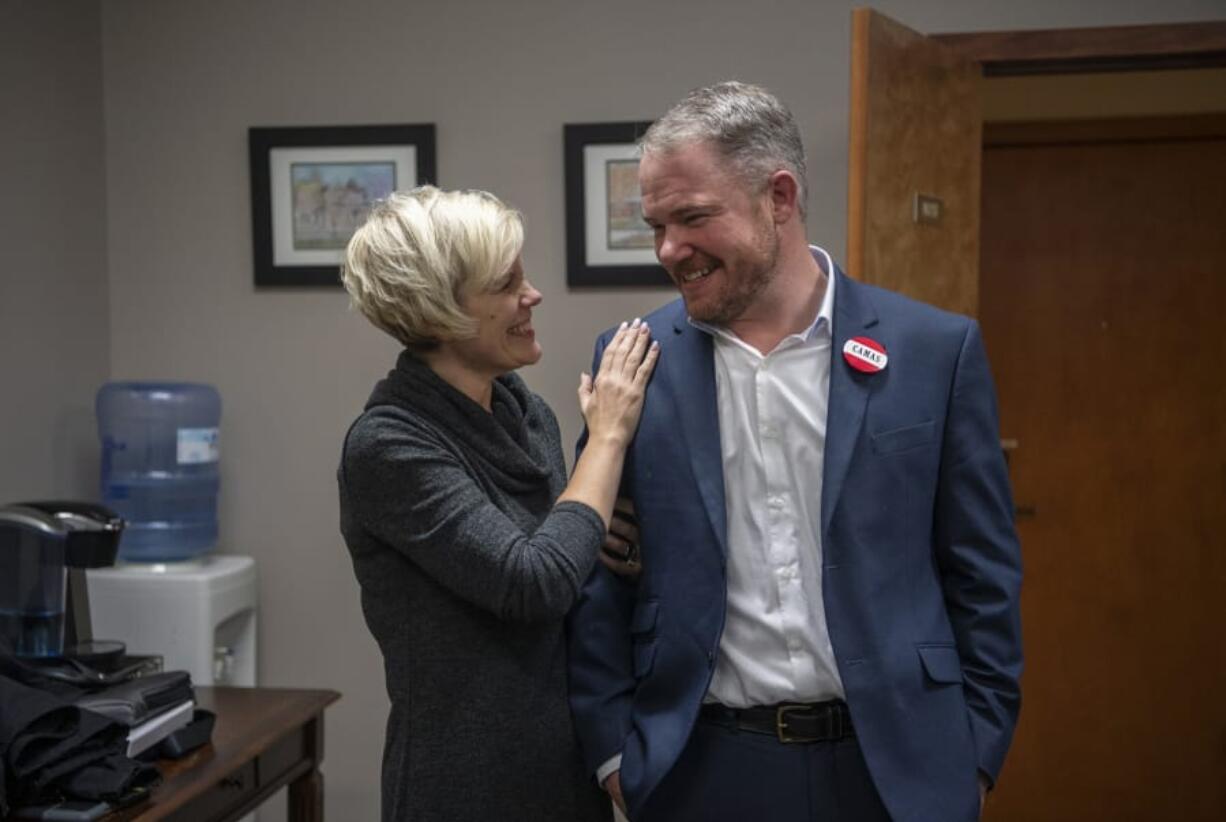 Anastasia McDonnell congratulates her husband, Barry McDonnell, after he was sworn in Tuesday as the mayor of Camas.