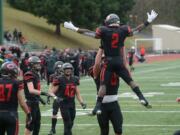 Camas running back Jacques Badolato-Birdsell is hoisted by teammate Rush Reimer after scoring a touchdown against Mount Si at McKenzie Stadium on Saturday afternoon, November 30, 2019. Camas beat Mount Si 35-14 to move on to the 4A state title game.