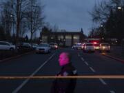 A Clark County Sheriff’s deputy stands just inside police tape following a shooting at Sarah J. Anderson Elementary School on Nov. 26.