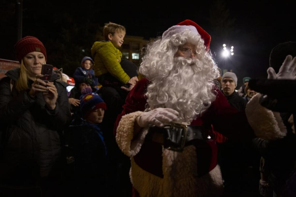 The star of Friday night&#039;s tree lighting, Santa, arrived on a Vancouver Fire Department fire engine and walked through a crowd of thousands to officially light Vancouver&#039;s Christmas tree and welcome in the holiday season.