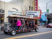 People on the Couve Cycle party cycle peddle their way to the next small-business shopping destination during Saturday&#039;s Sip, Shop &amp; Spin tour in downtown Vancouver. &quot;We&#039;re always looking for other options to get people out there,&quot; Couve Cycle owner Michael Palensky said.