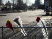 Flowers have  been placed in the fence of Sarah J. Anderson Elementary School as a memorial to victims of Tuesday&#039;s shooting.