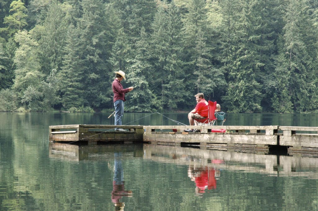 Anglers busy trout fishing on the aging dock at Battle Ground Lake State Park.