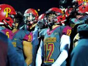 Prairie senior Zack Brown screams in celebrations after the Falcons&#039; 42-14 win over Evergreen on Friday.