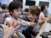 Ninth-graders Max Morrison, from left, Andres Indriago and Alex Anyse play League of Legends during the Washington-Liberty High School&#039;s team practice in October.