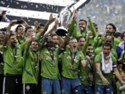 Seattle Sounders celebrate Sunday, Nov. 10, 2019, after the team beat the Toronto FC in the MLS Cup championship soccer match in Seattle. The Sounders won 3-1.