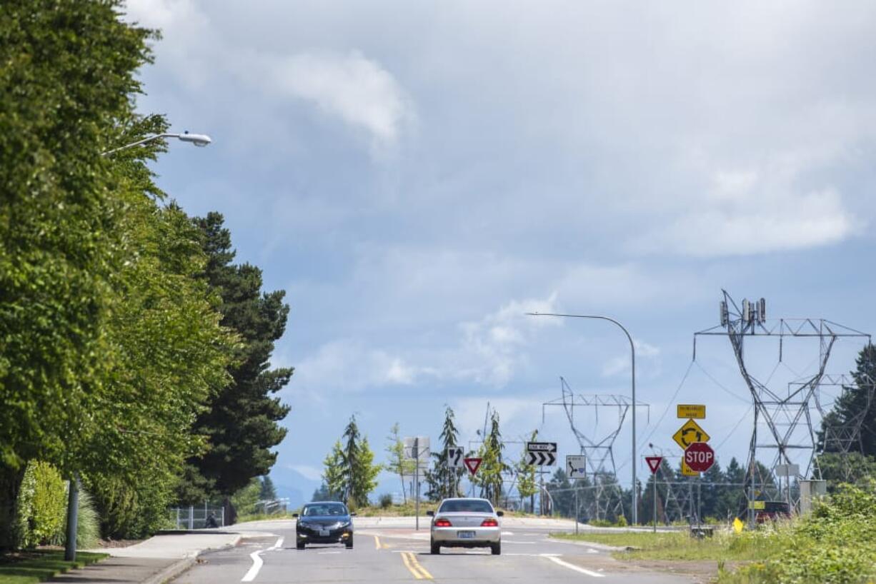 Cars navigate a traffic circle June 7 on Northeast 18th Street a few blocks past the site of proposed improvements in Vancouver. The city has allocated $1 million in Transportation Benefit District funds to fixing an awkward gap on Northeast 18th Street.