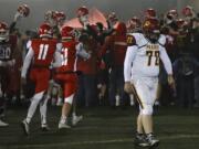 Prairie's Jake Hylton walks away from Marysville-Pilchuck's celebration Friday evening at Quil Ceda Stadium in Marysville on November 15, 2019. Marysville-Pilchuck won 37-30 in overtime.