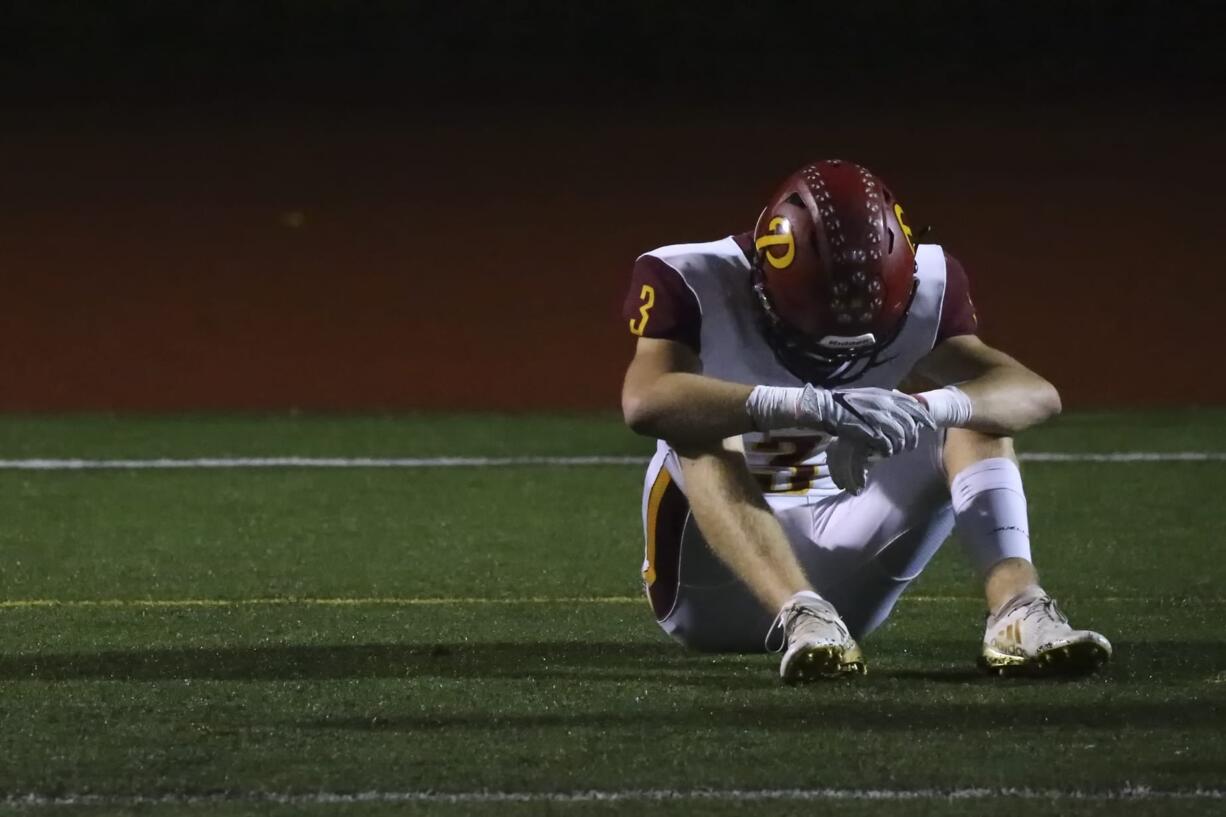 Prairie's Ian Davis sits dejected Friday evening at Quil Ceda Stadium in Marysville on November 15, 2019. Marysville-Pilchuck won 37-30 in overtime.