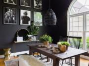 &quot;Whether sleek and modern or rustic farmhouse, black paint and decor offers a sophisticated air to many different looks,&quot; says Briana Nix, who designed this black dining space.