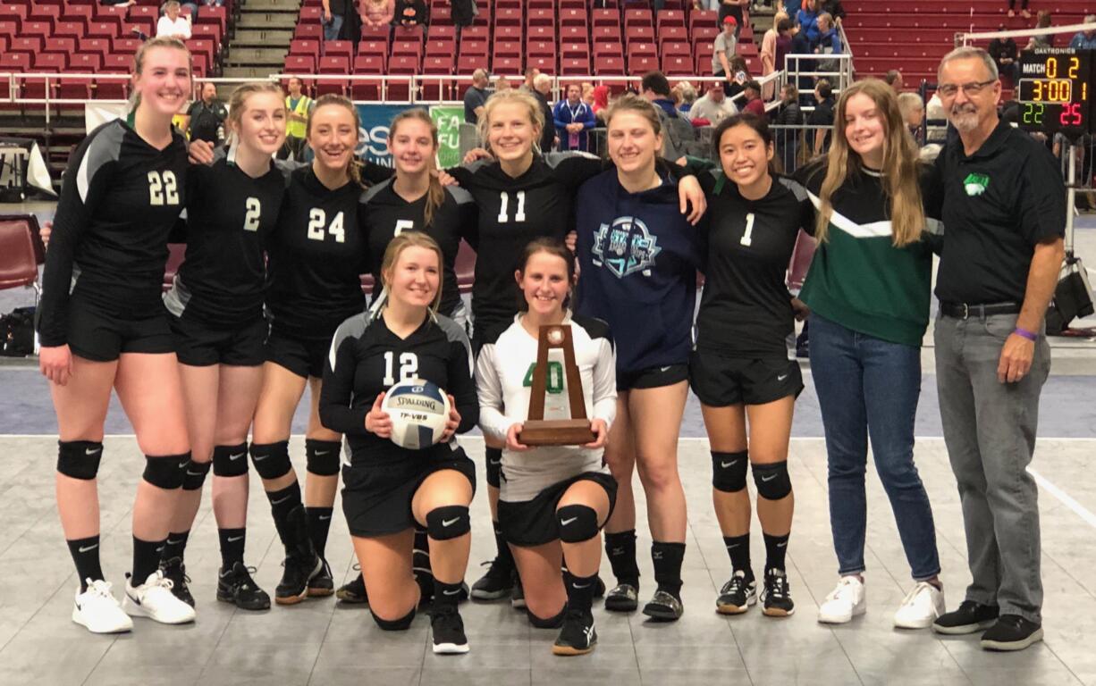 The Firm Foundation volleyball team poses with its seventh-place team trophy at the 1B state tournament in Yakima on Friday, Nov. 15, 2019.