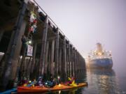 Five protesters were arrested late Tuesday morning while attempting to block a ship from unloading pieces of oil pipe at the Port of Vancouver. The protesters arrived early in the morning in boats and positioned themselves in the Columbia River at the base of one of the port docks.