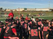 Fort Vancouver players listen to head coach Neil Lomax postgame after Saturday’s 42-7 los to West Seattle. The Trappers went 1-8 in their first season as an independent.