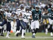 Seattle Seahawks' Rashaad Penny (20) runs for a touchdown during the second half of an NFL football game against the Philadelphia Eagles, Sunday, Nov. 24, 2019, in Philadelphia.