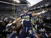 Seattle Seahawks tight end Jacob Hollister celebrates after he scored a touchdown against the Tampa Bay Buccaneers in overtime of an NFL football game Sunday, Nov. 3, 2019, in Seattle.