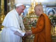 In this photo released by Wat Ratchabophit Sathit Maha Simaram Temple, Pope Francis, left, visits the Supreme Buddhist Patriarch of Thailand Somdet Phra Sangkharat Sakonlamahasangkhaparrinayok at the temple in Bangkok, Thailand Thursday, Nov. 21, 2019.