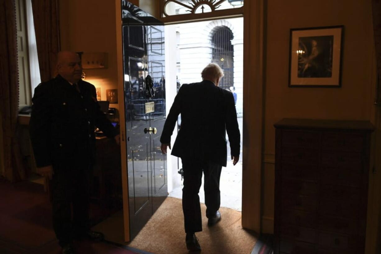 Britain&#039;s Prime Minister Boris Johnson leaves 10 Downing Street on route to Buckingham Palace ahead of an audience with Queen Elizabeth II and the formal start of the General Election, in London, Wednesday, Nov.