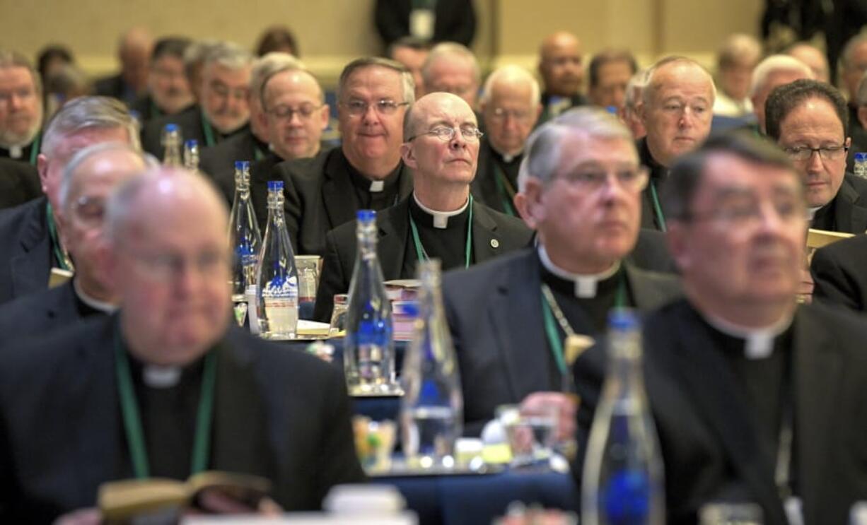 Bishops are seated during the opening moments of the United States Conference of Catholic Bishops Fall General Assembly at the Baltimore Marriott Waterfront Monday, Nov. 11, 2019.