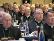 Bishops are seated during the opening moments of the United States Conference of Catholic Bishops Fall General Assembly at the Baltimore Marriott Waterfront Monday, Nov. 11, 2019.