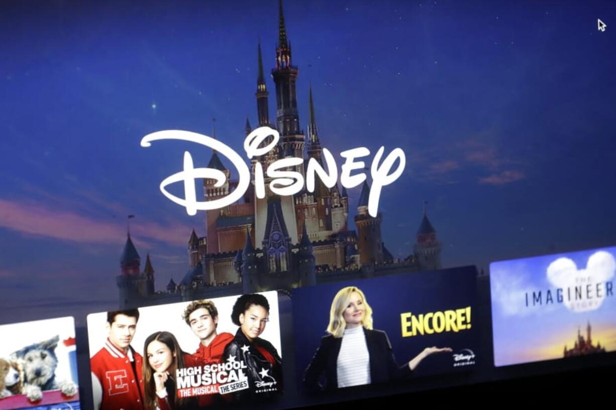 FILE - In this Wednesday, Nov. 13, 2019 file photo, a Disney logo forms part of a menu for the Disney Plus movie and entertainment streaming service on a computer screen in Walpole, Mass. Disney Plus says it doesn&#039;t have a security breach, but some users of the new streaming service have been shut out after hackers tried to break into their accounts.