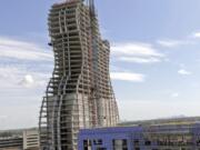 FILE - In this July 9, 2018 file photo, the new guitar tower is constructed as part of the guitar-shaped Seminole Hard Rock Hotel and Casino slated to open next year in Hollywood, Fla.  It looks like the guitar Led Zeppelin&#039;s Jimmy Page played. But this one is 450 feet (137 meters) tall and is a light-beam hotel that the Seminole Tribe wants to become South Florida&#039;s latest tourist destination. The Guitar Hotel&#039;s grand opening is Thursday, Oct. 24, 2019, on the tribe&#039;s land in Hollywood. It&#039;s the latest step in the Seminole Hard Rock empire, which includes naming rights on the Miami-area stadium where the 2020 Super Bowl will be played.