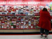 A customer shops for greeting cards at a Target store in Chicago. It&#039;s that holiday card time of year again. But before you open up the address book or spreadsheet, read up on some modern etiquette for how to address your recipients. (Nam Y.