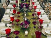 A table setting design by interior designer Elizabeth Stuart in a residence in Charleston, S.C. When setting a beautiful holiday table, consider using several small, low centerpieces rather than one large one.