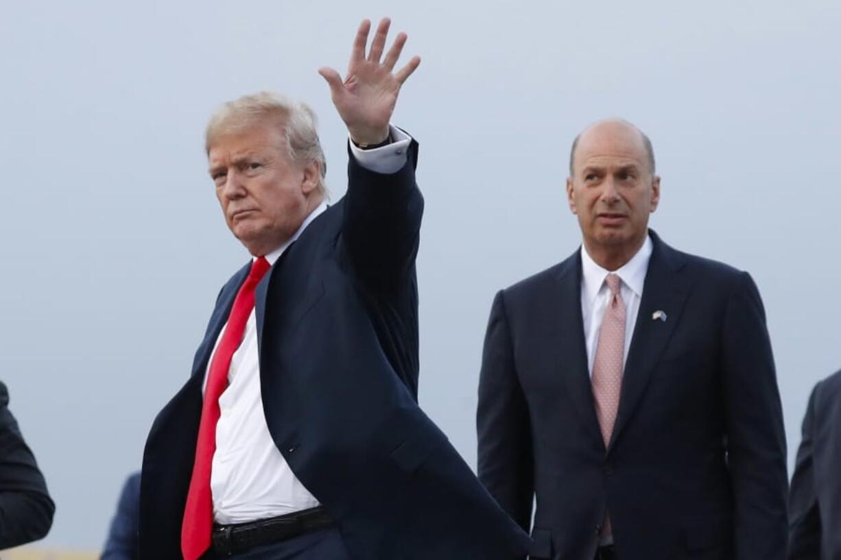 FILE - In this July 10, 2018, file photo, President Donald Trump is joined by Gordon Sondland, the U.S. ambassador to the European Union, second from right, as he arrives at Melsbroek Air Base, in Brussels, Belgium. Sondland originally planned to meet Tuesday, Nov 19, with EU Commission Vice President Valdis Dombrovskis to discuss better cooperation between the two trading juggernauts. That meeting was postponed indefinitely because Sondland was to testify Wednesday before Congress about his involvement in Ukraine.