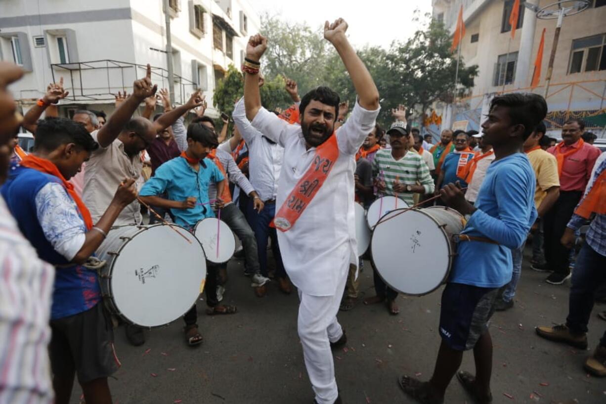 Supporters of Vishwa Hindu Parishad (VHP), or World Hindu Council, celebrate the Supreme Court&#039;s verdict outside the VHP office in Ahmadabad, India, Saturday, Nov. 9, 2019. India&#039;s Supreme Court has ruled in favor of a Hindu temple on a disputed religious ground and ordered that alternative land be given to Muslims. The dispute over land ownership has been one of the country&#039;s most contentious issues.
