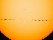 In this composite image, the planet Mercury is visible as it passes directly between the sun and Earth on May 9, 2016, in a transit which lasted 7 1/2  hours. On Monday morning, Mercury will make another transit.