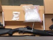 Vancouver police arrested a wanted man Sunday and seized two pistols, a shotgun, tactical equipment, holsters, ammunition, 2.2 pounds of methamphetamine, 0.25 ounces of cocaine, and drug paraphernalia and materials used for distribution.