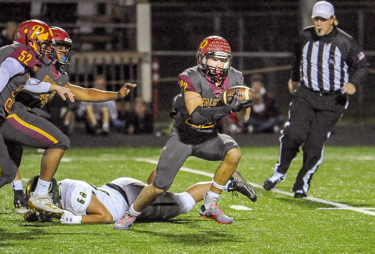 Dustin Shelby recovers a fumble and runs it in for a 16-yard touchdown in Prairie’s 42-14 win over Evergreen on Friday at District Stadium in Battle Ground.