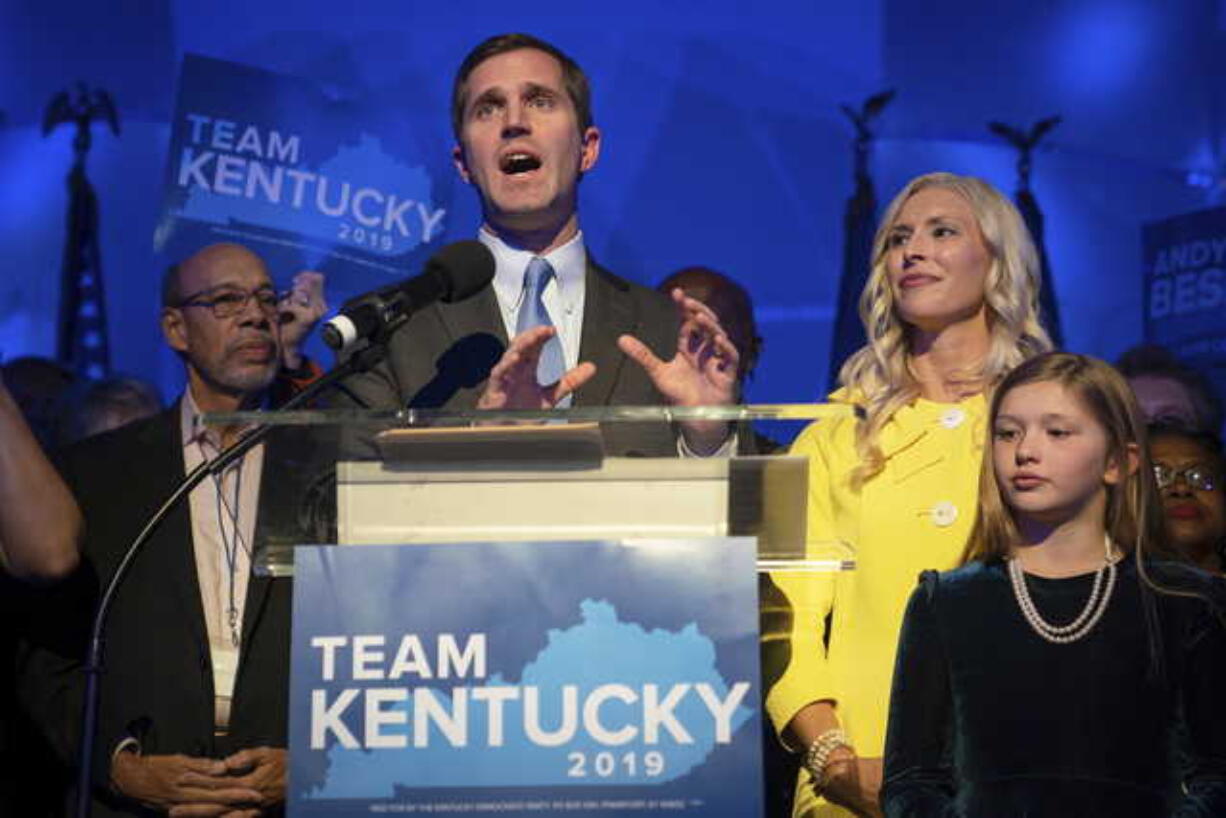 Kentucky Attorney General and democratic Gubernatorial Candidate Andy Beshear stands with his wife, Britainy as he delivers a speech at the Kentucky Democratic Party election night watch party, Tuesday, Nov. 5, 2019, in Louisville, Ky.