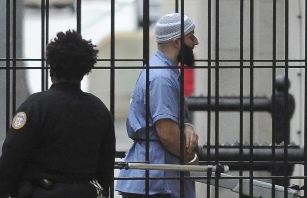 FILE - In this Feb. 3, 2016 file photo, Adnan Syed enters Courthouse East in Baltimore prior to a hearing.