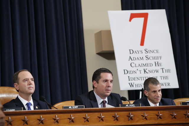 Ranking member Rep. Devin Nunes of Calif., gives his opening state before U.S. Ambassador to the European Union Gordon Sondland testifies before the House Intelligence Committee on Capitol Hill in Washington, Wednesday, Nov. 20, 2019, during a public impeachment hearing of President Donald Trump's efforts to tie U.S. aid for Ukraine to investigations of his political opponents. House Intelligence Committee Chairman Adam Schiff, D-Calif., left, and Steve Castor, right, the Republican staff attorney.