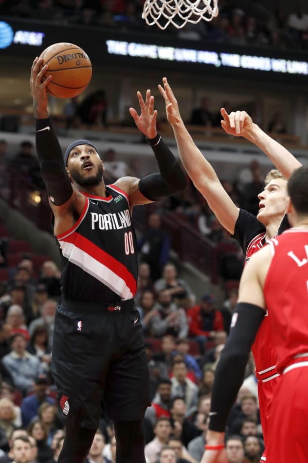 Portland Trail Blazers&#039; Carmelo Anthony scores past Chicago Bulls&#039; Lauri Markkanen during the first half of an NBA basketball game Monday, Nov. 25, 2019, in Chicago.