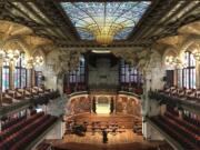 This Oct. 14, 2019 photo shows the inside of Palau de la M?sica Catalana, built by famed architect Llu?s Dom?nech I Montaner, in Barcelona, Spain. A required tour of the music hall&#039;s crescendo of colorful stained glass and mosaics is pricey but worth it, and you may even catch musicians practicing.