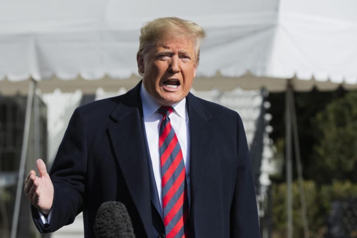 President Donald Trump talks to the media before leaving the White House, Saturday, Nov. 9, 2019, in Washington.  Trump is attending the NCAA college football game between Louisiana State University and Alabama in Tuscaloosa, Ala.