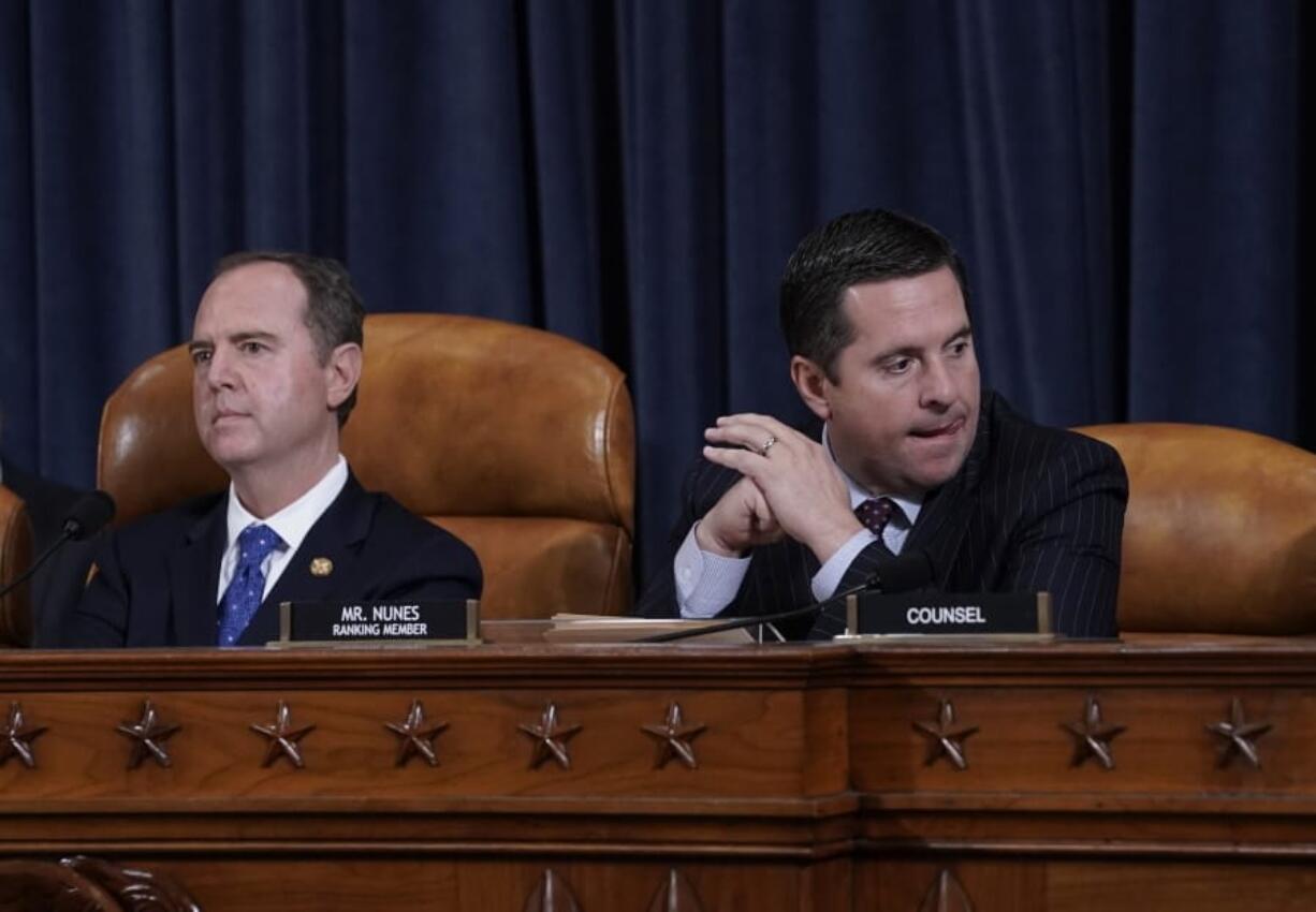 House Intelligence Committee Chairman Adam Schiff, D-Calif., left, with Rep. Devin Nunes, R-Calif, the ranking member, concludes a day of testimony by key witnesses as it probes President Donald Trump&#039;s efforts to tie U.S. aid for Ukraine to investigations of his political opponents, on Capitol Hill in Washington, Wednesday, Nov. 20, 2019. (AP Photo/J.