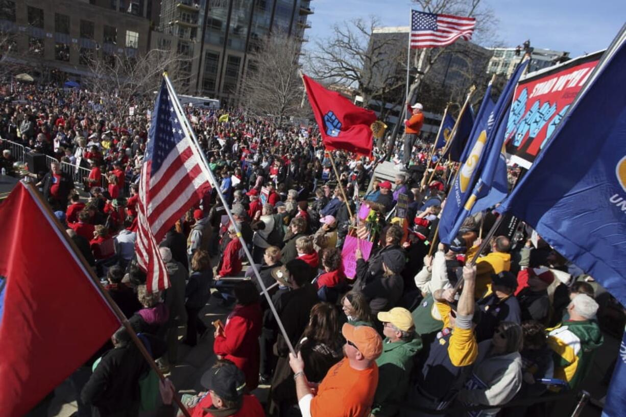 FILE - In this March 10, 2012, file photo, labor groups and others rally in front of the state capitol building in Madison, Wis., in an effort to recall then-Wisconsin Gov. Scott Walker. Democrats&#039; drive to impeach President Donald Trump has a parallel in Wisconsin, where angry liberals took aim at Gov. Scott Walker in 2012 after he eviscerated public employee unions. Their recall attempt energized partisans on both sides, but ultimately backfired when it failed to persuade moderates to kick the Republican Walker out of office early.