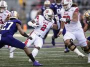 Utah running back Zack Moss (2) runs with the ball during the first half of an NCAA college football game against Washington, Saturday, Nov. 2, 2019, in Seattle.