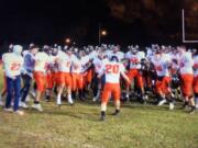 Washougal players celebrate a 28-7 win over W.F. West in the 2A District crossover game Friday at Bearcat Stadium.