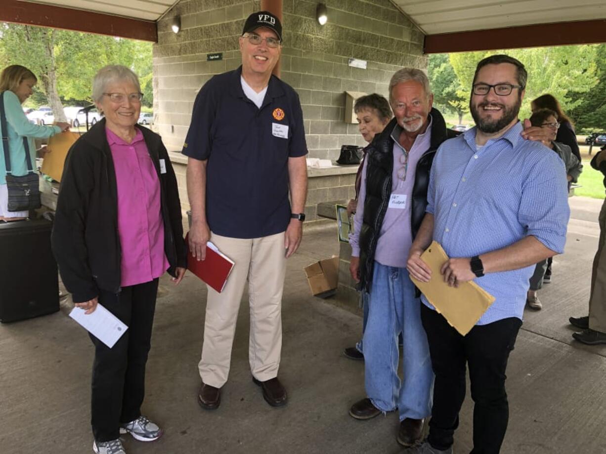 Jane Shields Lussier, from left, the daughter of former high school football coach Dutch Shields; John Gentry, of the Vancouver Fire Department; Pat Klinger, retired marketer at Burgerville and group founder; and Brad Richardson, executive director of the Clark County Historical Museum, gathered at a picnic in September for the Facebook group "Growing up in Vancouver, WA." (Contributed photo)