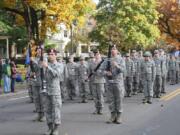 The Prairie High School Armed Drill Team performs at a past veterans parade.