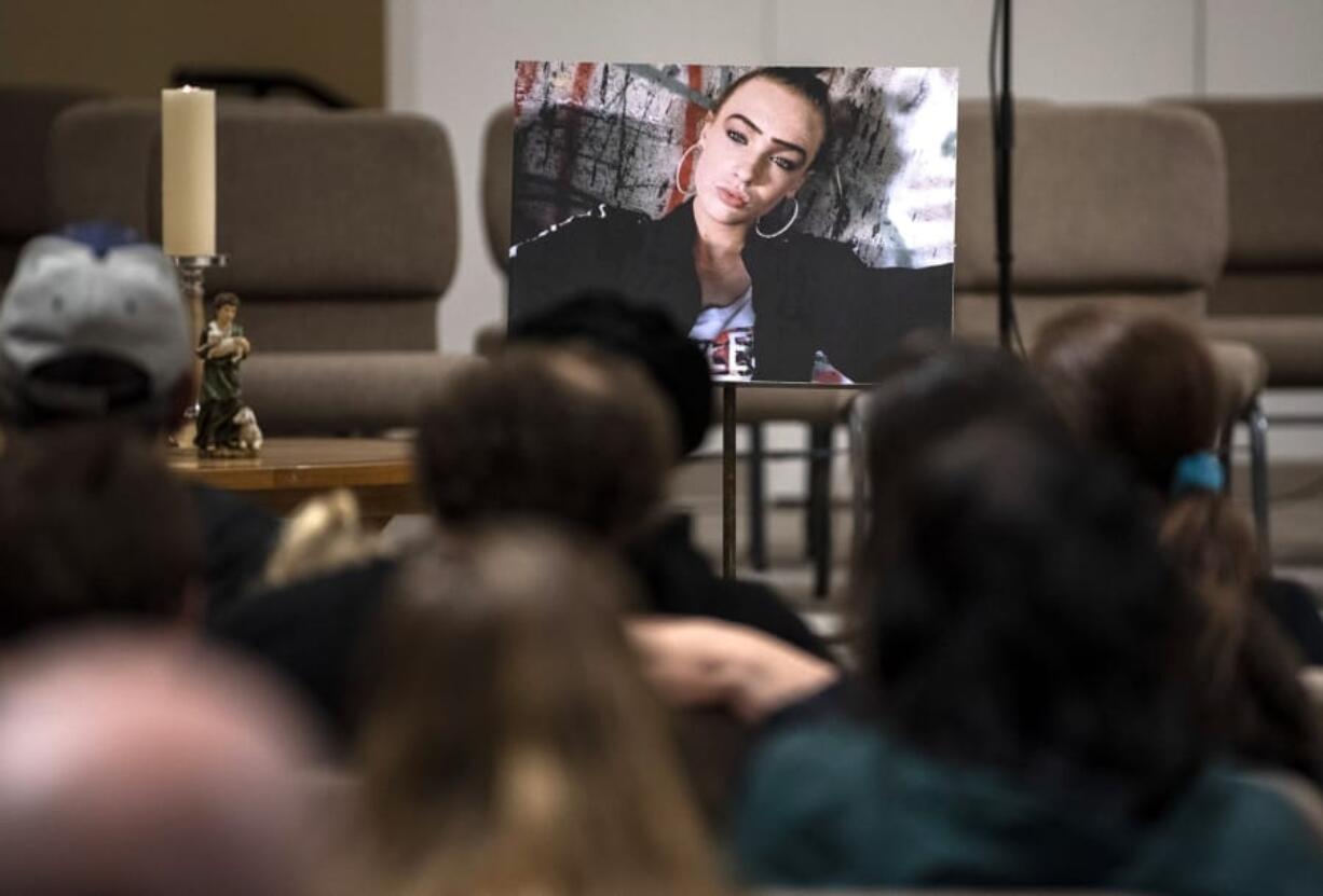 A photo of Nikki Kuhnhausen is placed at the front of the room during the vigil at the Vancouver United Church of Christ in Vancouver on Dec. 20, 2019.