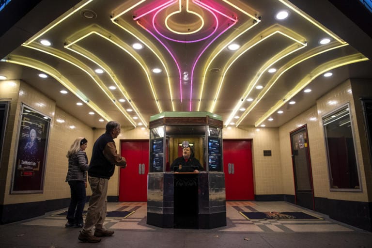 Richard Beer, programming director at the Kiggins Theatre, staffs the box office for a live performance of &quot;In Flight with D.B. Cooper,&quot; an original radio play.